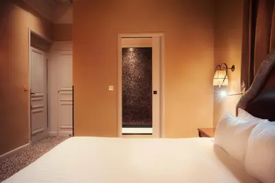 Un ou plusieurs lits dans un hébergement de l'établissement Hotel Odeon Saint-Germain