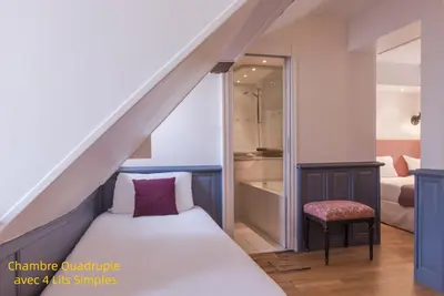 Un ou plusieurs lits dans un hébergement de l'établissement Hôtel Gaillon Opera