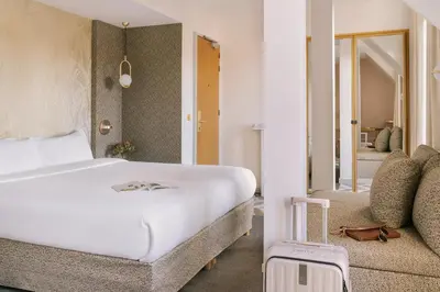 Un ou plusieurs lits dans un hébergement de l'établissement Hôtel Atala Champs Elysees