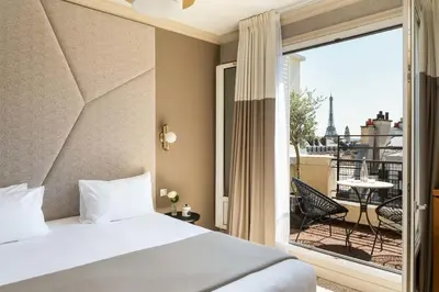 Un ou plusieurs lits dans un hébergement de l'établissement Hôtel Atala Champs Elysees