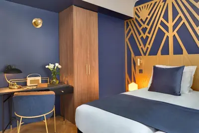 Un ou plusieurs lits dans un hébergement de l'établissement Hôtel Artemisia Montmartre