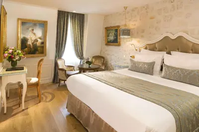 Un ou plusieurs lits dans un hébergement de l'établissement Académie Hôtel Saint Germain