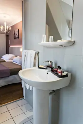 Un ou plusieurs lits dans un hébergement de l'établissement Modern Hotel