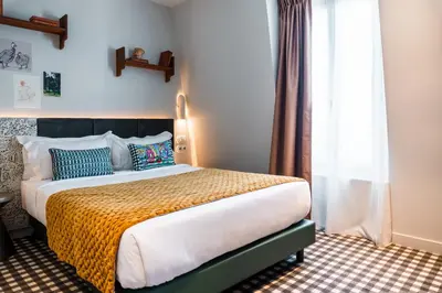 Un ou plusieurs lits dans un hébergement de l'établissement Kraft Hotel