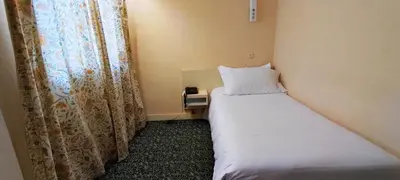 Un ou plusieurs lits dans un hébergement de l'établissement Grand Hôtel du Havre