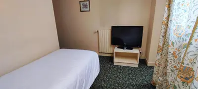 Télévision ou salle de divertissement dans l'établissement Grand Hôtel du Havre
