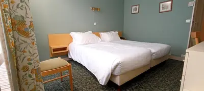 Un ou plusieurs lits dans un hébergement de l'établissement Grand Hôtel du Havre