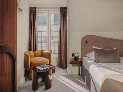 Un ou plusieurs lits dans un hébergement de l'établissement Hôtel Belloy