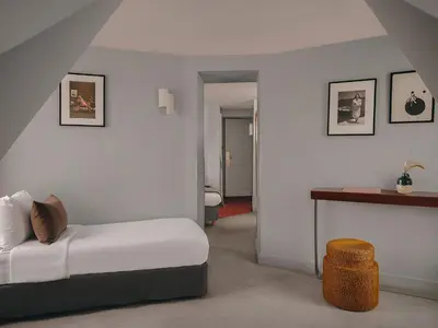 Un ou plusieurs lits dans un hébergement de l'établissement Hôtel Belloy