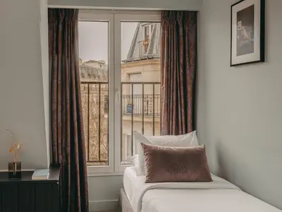 Un ou plusieurs lits dans un hébergement de l'établissement Hôtel Belloy