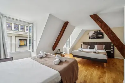 Un ou plusieurs lits dans un hébergement de l'établissement Hôtel Mazagran