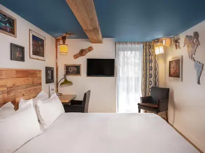 Un ou plusieurs lits dans un hébergement de l'établissement Hôtel Edgar & Achille