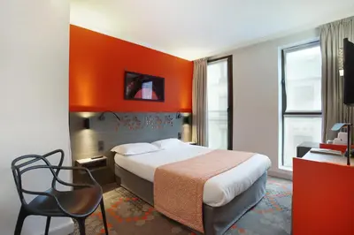 Télévision ou salle de divertissement dans l'établissement Hotel Eiffel Capitol