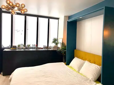 Un ou plusieurs lits dans un hébergement de l'établissement Relais Cocorico Fondary Apartment Eiffel Tower District
