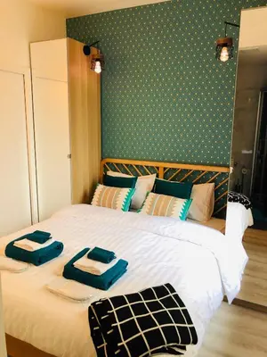 Un ou plusieurs lits dans un hébergement de l'établissement Relais Cocorico Fondary Apartment Eiffel Tower District