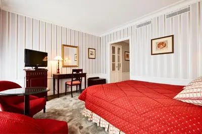 Un ou plusieurs lits dans un hébergement de l'établissement Golden Tulip Washington Opera