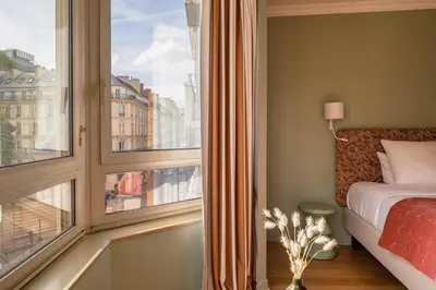 Un ou plusieurs lits dans un hébergement de l'établissement Royal Garden Champs-Élysées