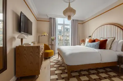 Un ou plusieurs lits dans un hébergement de l'établissement Miiro Le Grand Hôtel Cayré