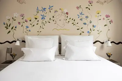 Un ou plusieurs lits dans un hébergement de l'établissement Hôtel Arvor Saint Georges