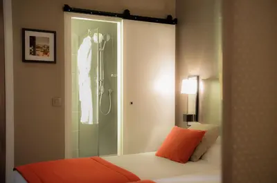 Un ou plusieurs lits dans un hébergement de l'établissement Hôtel Marais Bastille