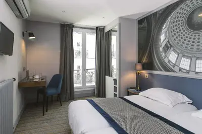 Un ou plusieurs lits dans un hébergement de l'établissement Hotel Saint Christophe
