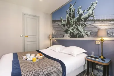 Un ou plusieurs lits dans un hébergement de l'établissement Hotel Saint Christophe