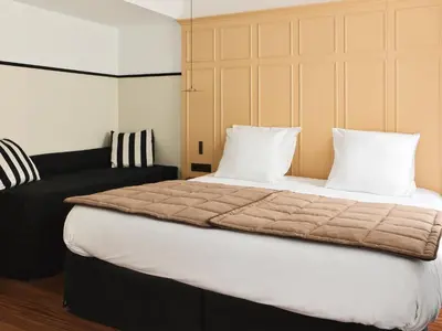 Un ou plusieurs lits dans un hébergement de l'établissement New Hotel Lafayette