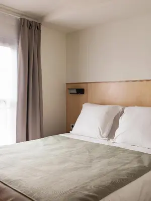 Un ou plusieurs lits dans un hébergement de l'établissement New Hotel Opéra