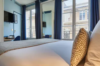 Un ou plusieurs lits dans un hébergement de l'établissement Hotel de Neuve by Happyculture