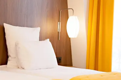 Un ou plusieurs lits dans un hébergement de l'établissement Best Western Plus 61 Paris Nation Hotel