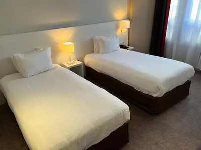 Un ou plusieurs lits dans un hébergement de l'établissement Holiday Inn Paris-Auteuil by IHG