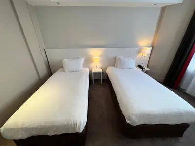 Un ou plusieurs lits dans un hébergement de l'établissement Holiday Inn Paris-Auteuil by IHG
