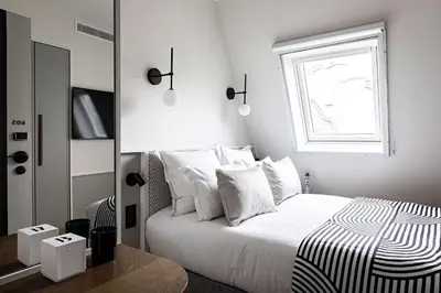 Un ou plusieurs lits dans un hébergement de l'établissement Best Western Premier The Blake Paris Gare Saint Lazare