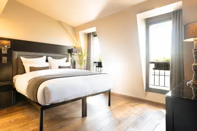 Un ou plusieurs lits dans un hébergement de l'établissement B Montmartre