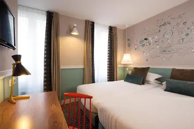 Un ou plusieurs lits dans un hébergement de l'établissement Hôtel des 3 Poussins
