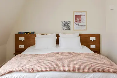 Un ou plusieurs lits dans un hébergement de l'établissement ALFRED HOTELS Paris Gare du Nord