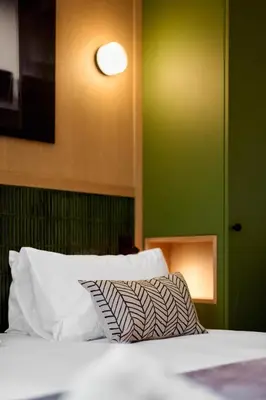 Un ou plusieurs lits dans un hébergement de l'établissement 6 VH Hotel