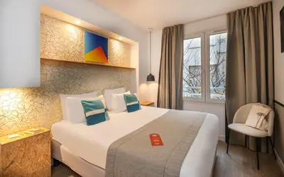 Un ou plusieurs lits dans un hébergement de l'établissement Hotel Izzy