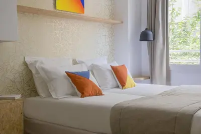 Un ou plusieurs lits dans un hébergement de l'établissement Hotel Izzy