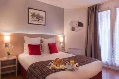 Un ou plusieurs lits dans un hébergement de l'établissement Dièse Hôtel Bastille