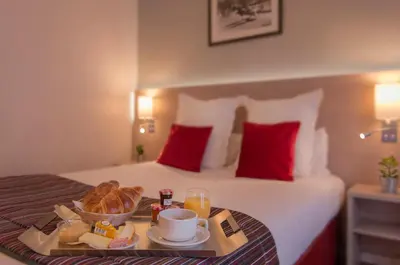 Un ou plusieurs lits dans un hébergement de l'établissement Dièse Hôtel Bastille