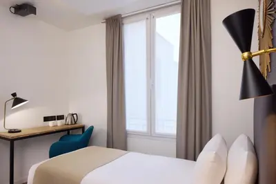 Un ou plusieurs lits dans un hébergement de l'établissement Hotel OHM by Happyculture