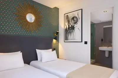 Un ou plusieurs lits dans un hébergement de l'établissement Hotel OHM by Happyculture