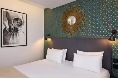 Un ou plusieurs lits dans un hébergement de l'établissement Hotel OHM by Happyculture