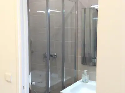 Salle de bains dans l'établissement Hôtel Richard