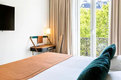 Un ou plusieurs lits dans un hébergement de l'établissement Hotel Le Friedland