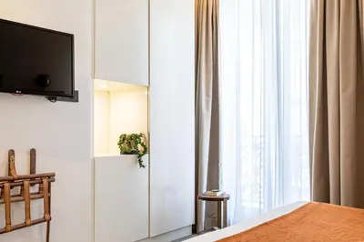 Télévision ou salle de divertissement dans l'établissement Hotel Le Friedland
