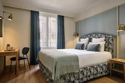 Un ou plusieurs lits dans un hébergement de l'établissement Hotel Etoile Saint Ferdinand by Happyculture