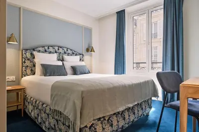 Un ou plusieurs lits dans un hébergement de l'établissement Hotel Etoile Saint Ferdinand by Happyculture