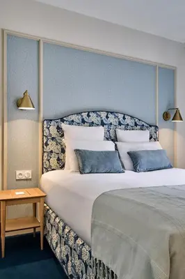 Un ou plusieurs lits dans un hébergement de l'établissement Hotel Etoile Saint Ferdinand by Happyculture